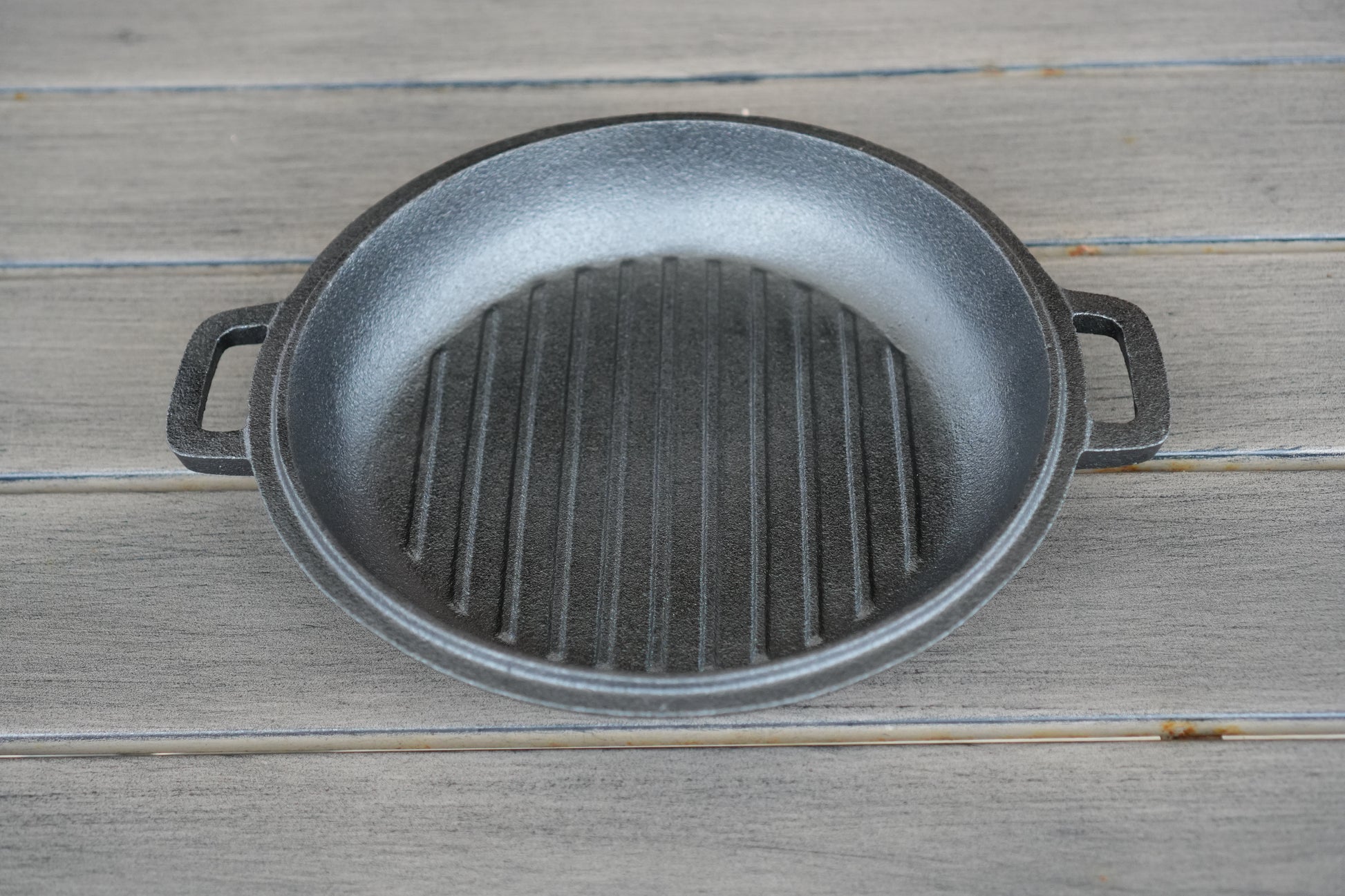 10 inch cast iron cauldron lid used as skillet over campfire
