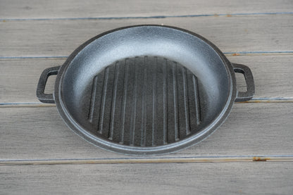 10 inch cast iron cauldron lid used as skillet over campfire