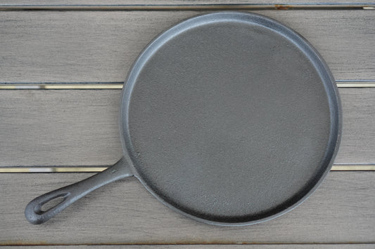 10 inch shallow cast iron skillet seasoned surface detail