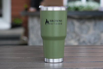 Green tumbler with 'Browns Outdoor' logo on a wooden surface