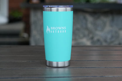 16 oz insulated tumbler in green on rock outdoors