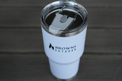 White tumbler with 'Browns Outdoor' logo on a wooden surface