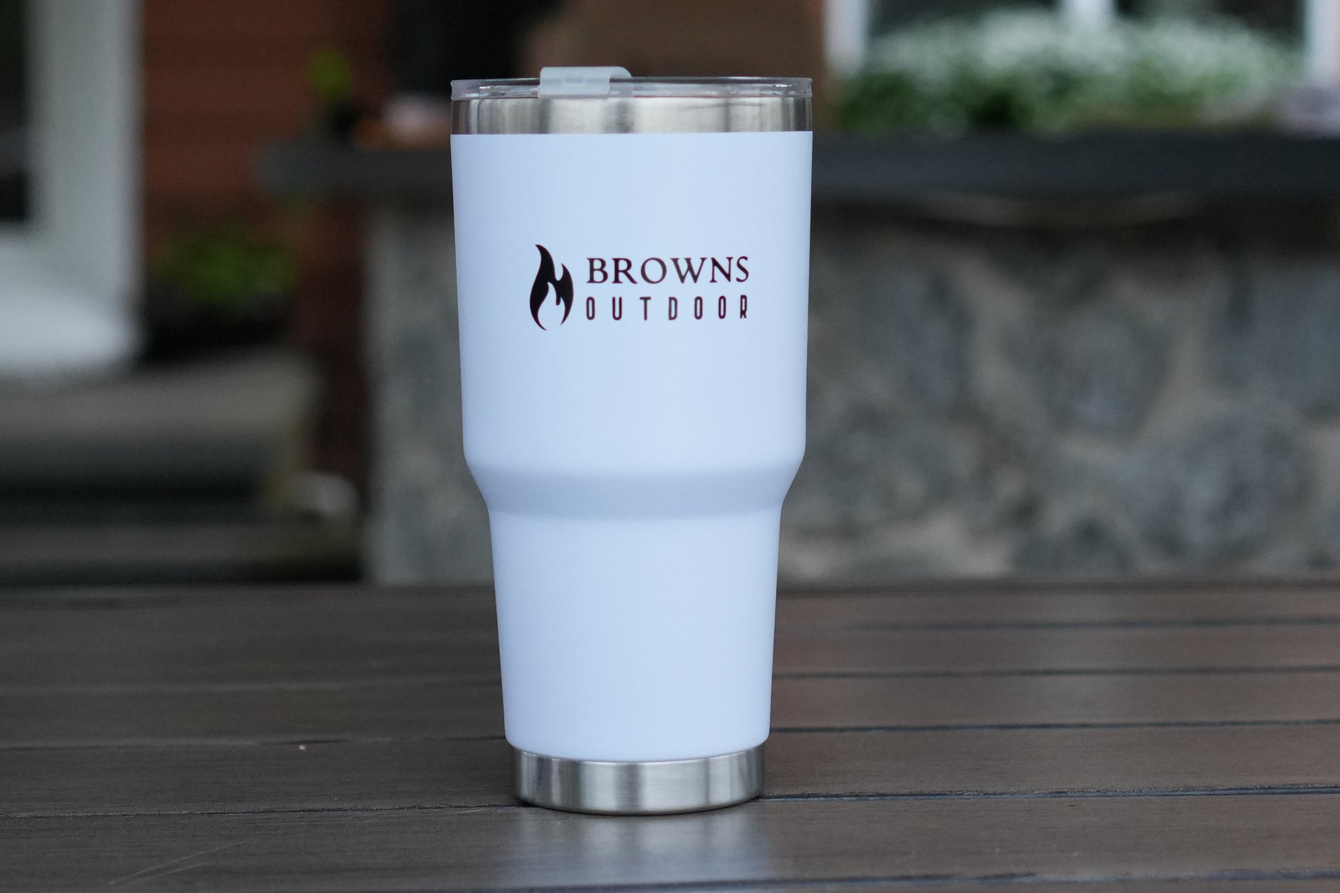 White tumbler with 'Browns Outdoor' logo on a wooden surface