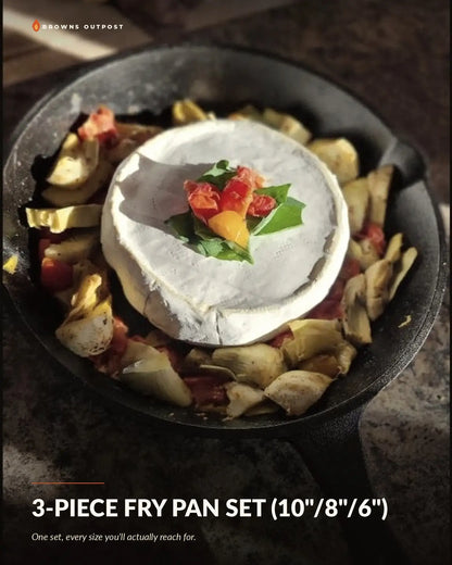 Browns Outpost 3-piece cast iron fry pan set (10"/8"/6") with brie and cheese cooking over a campfire. Text at the top reads 'Browns Outpost' and the bottom reads '3-PIECE FRY PAN SET' with a tagline reading 'One set, every size you'll actually reach for.'